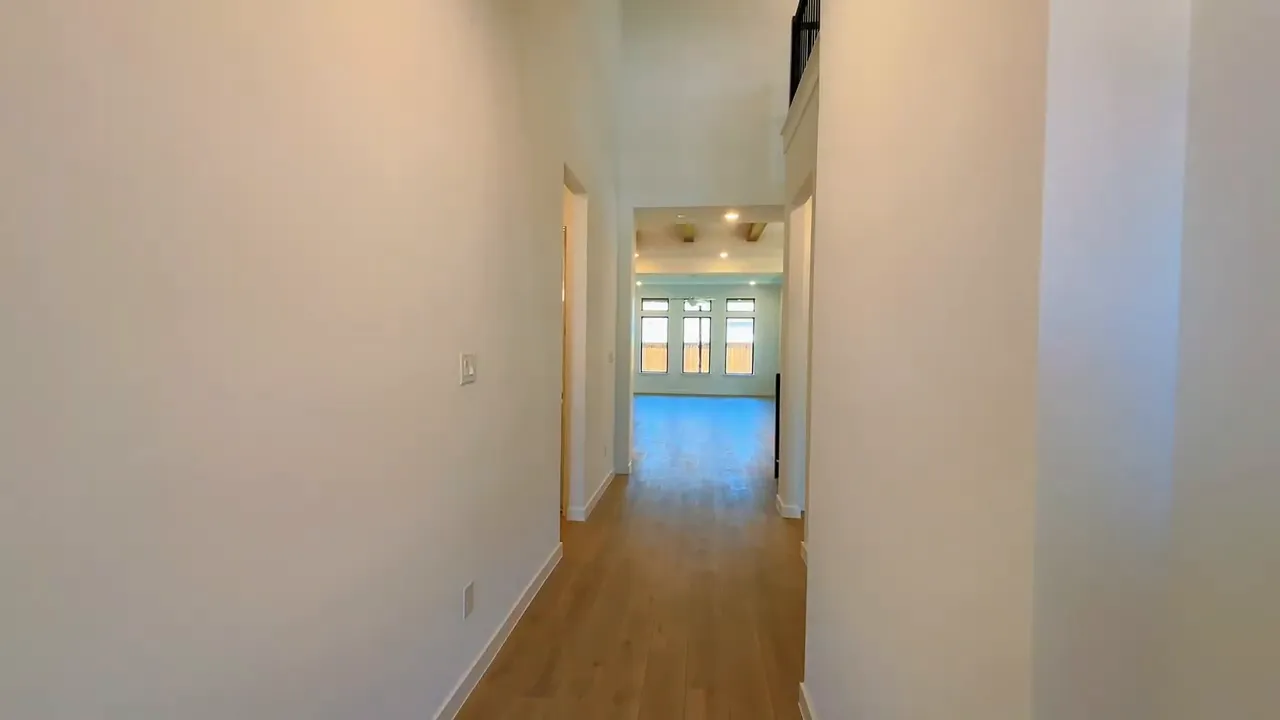 Long entry hallway with on screen text showing 4 bed 4.5 bath 3000 SQFT game room