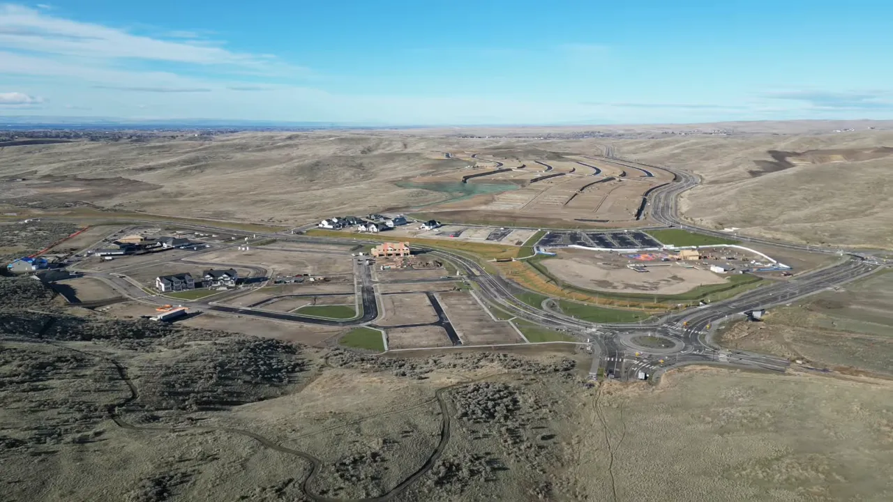 Aerial view of an Eagle, Idaho foothills development site with roads, construction areas, and surrounding open land