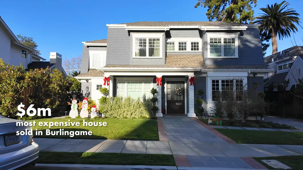 Large newer two story home with manicured front yard
