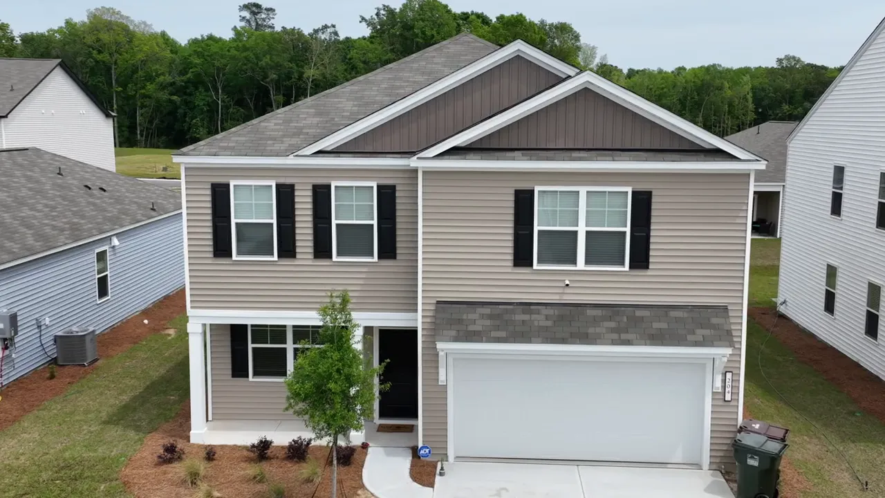 Aerial view of a new construction home in a suburban neighborhood