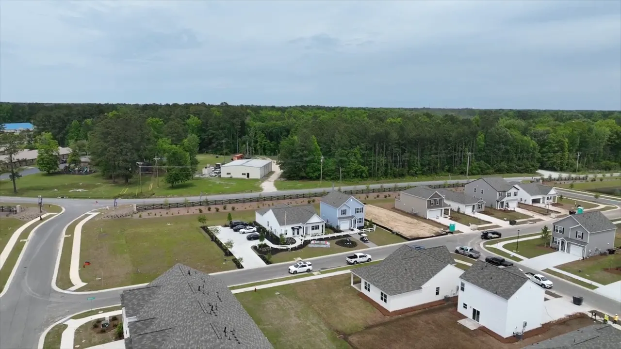Aerial view of a new suburban neighborhood with houses and curved roads