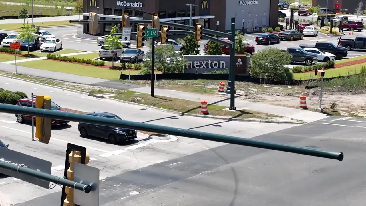 Nexton neighborhood entrance sign and traffic in Summerville, South Carolina