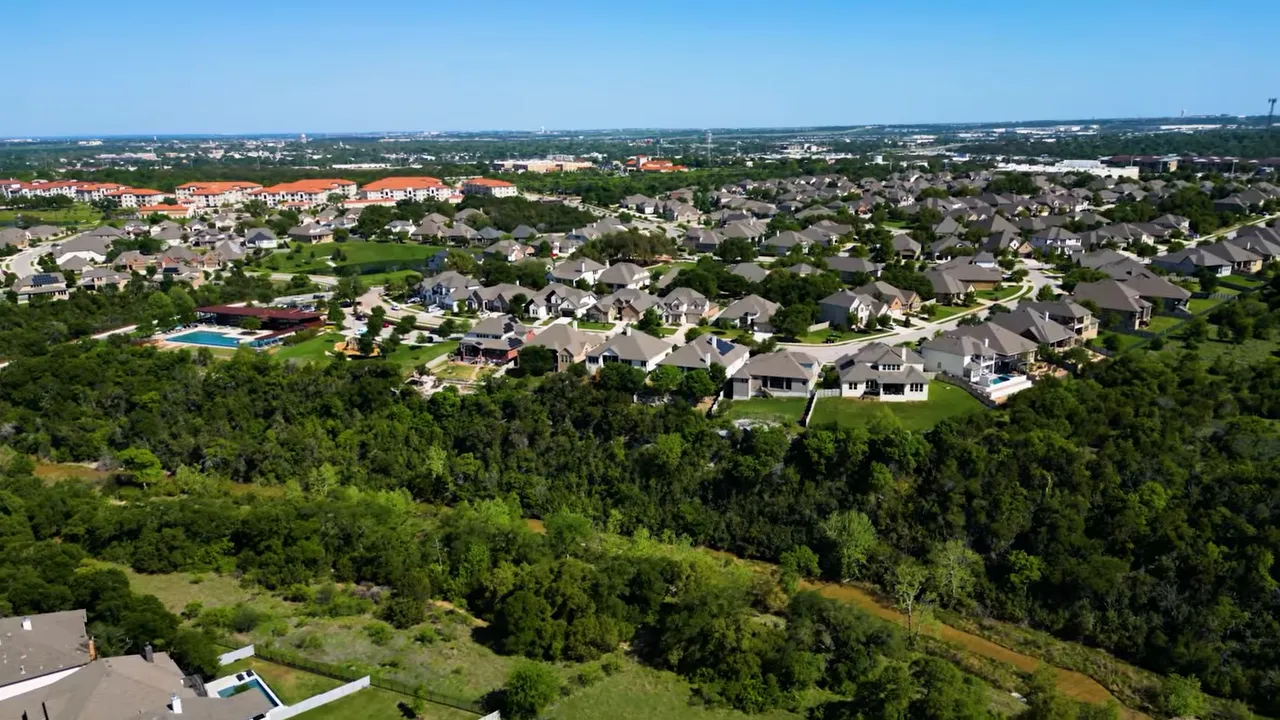 Aerial view of homes in Wolf Ranch with on screen median price 499000
