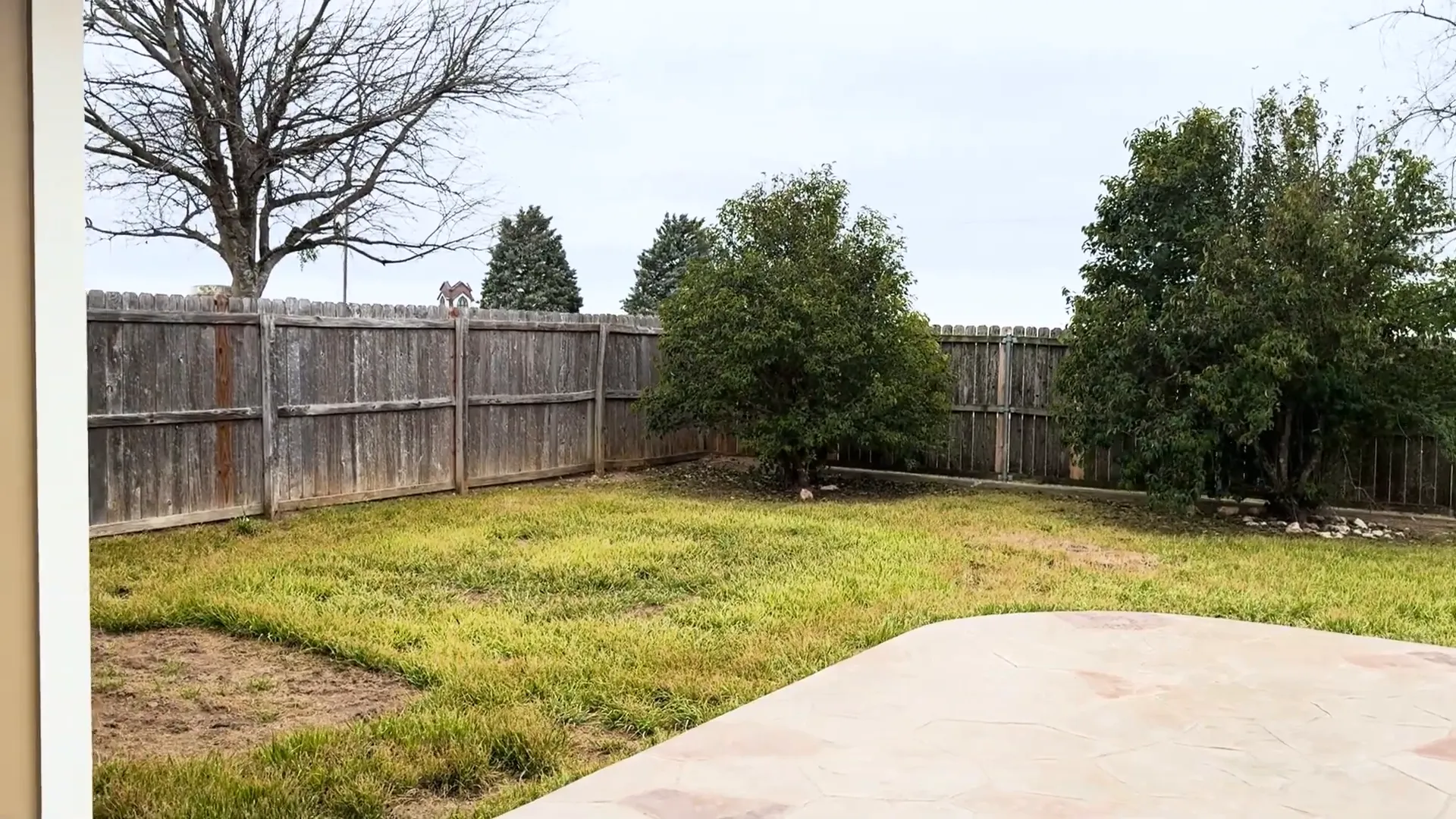 Spacious backyard with patio area for outdoor activities