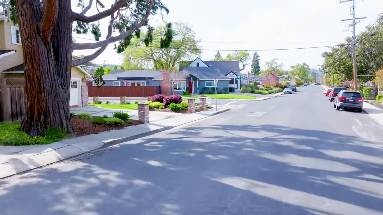 Street in San Carlos with a mix of architecture and parked cars