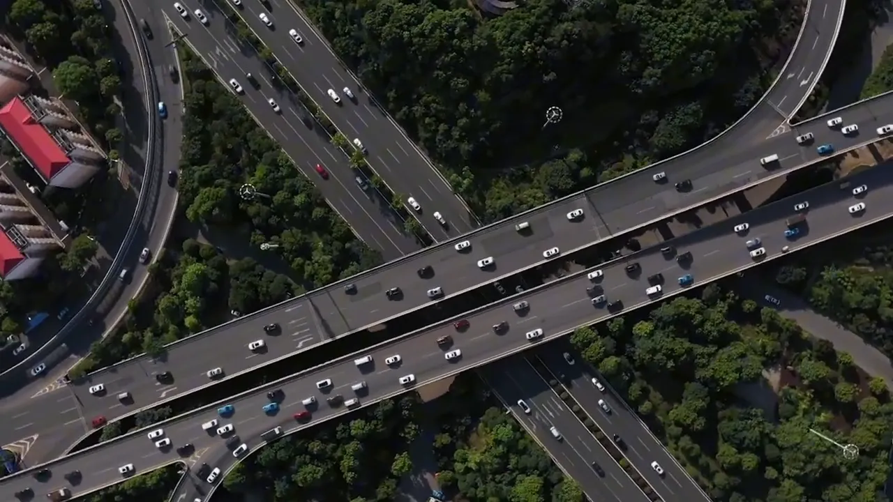 Aerial view of heavy traffic moving through a highway interchange
