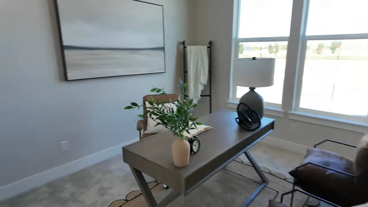 Secondary bedroom with two windows for natural light and 10-foot ceilings