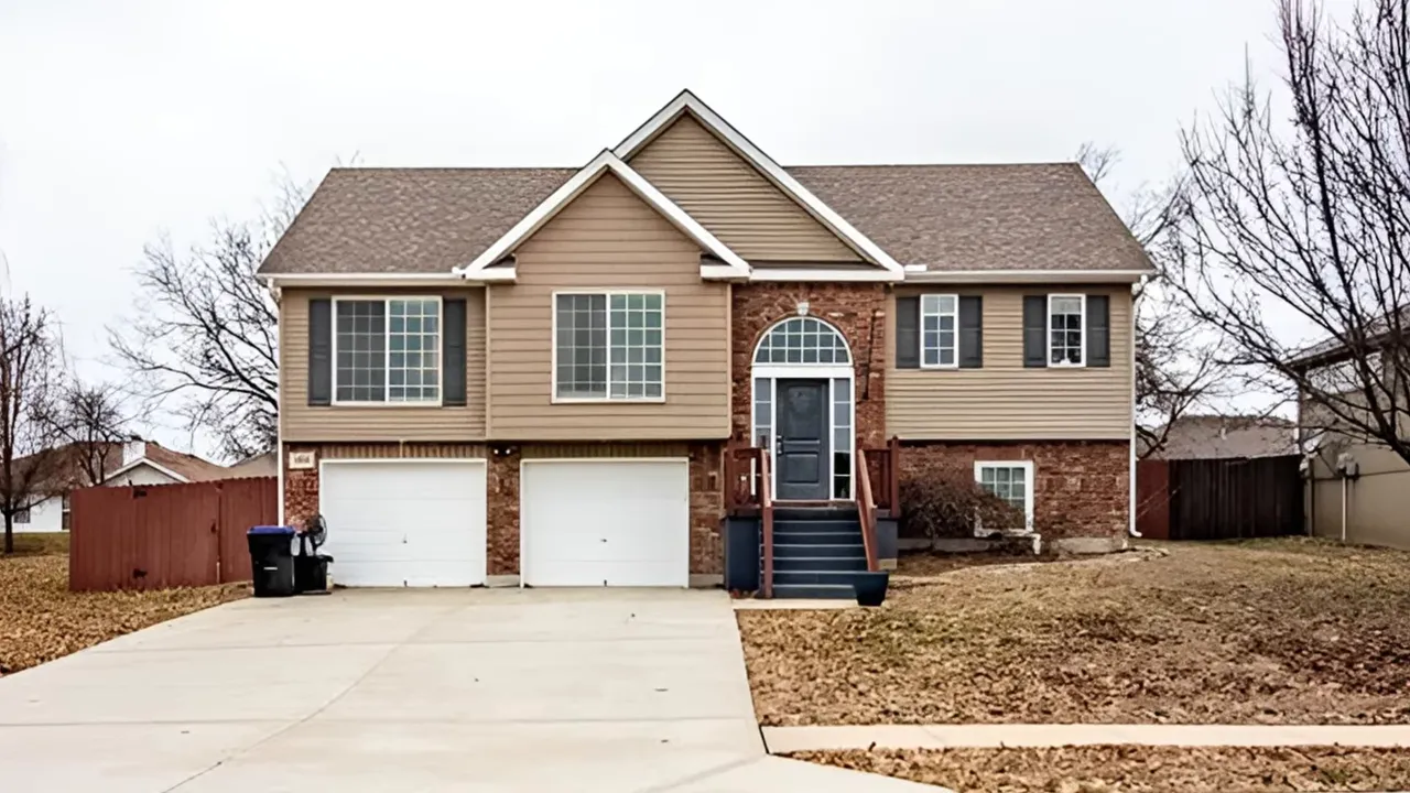 front exterior of two story split level home with double garage and front steps
