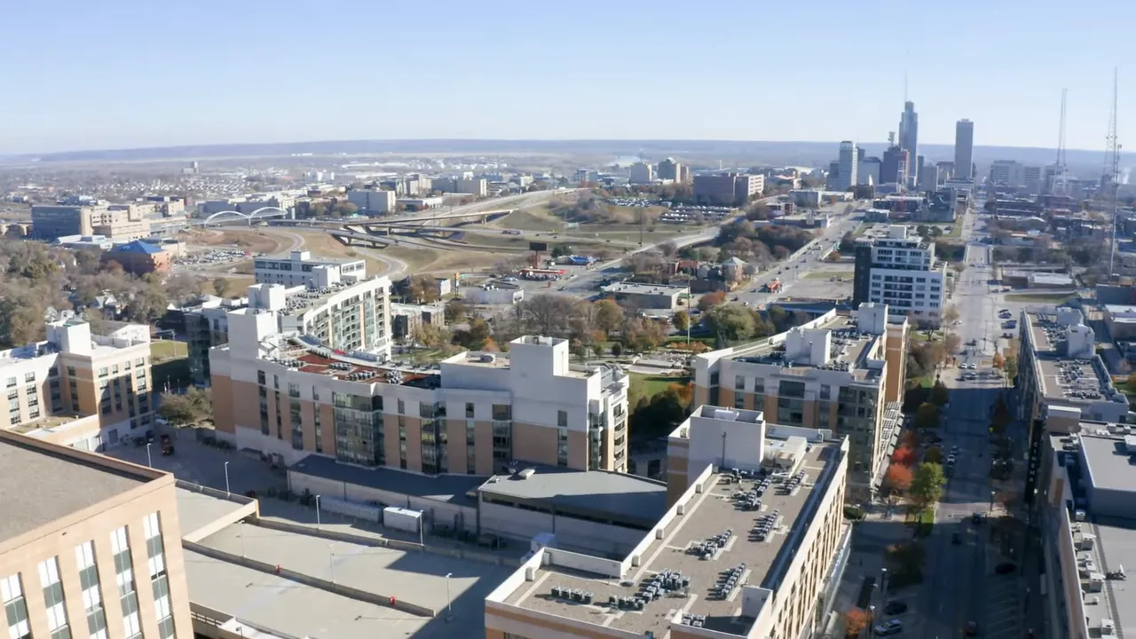 Aerial view of Omaha skyline and mid‑rise neighborhood near Aksarben and Elmwood Park