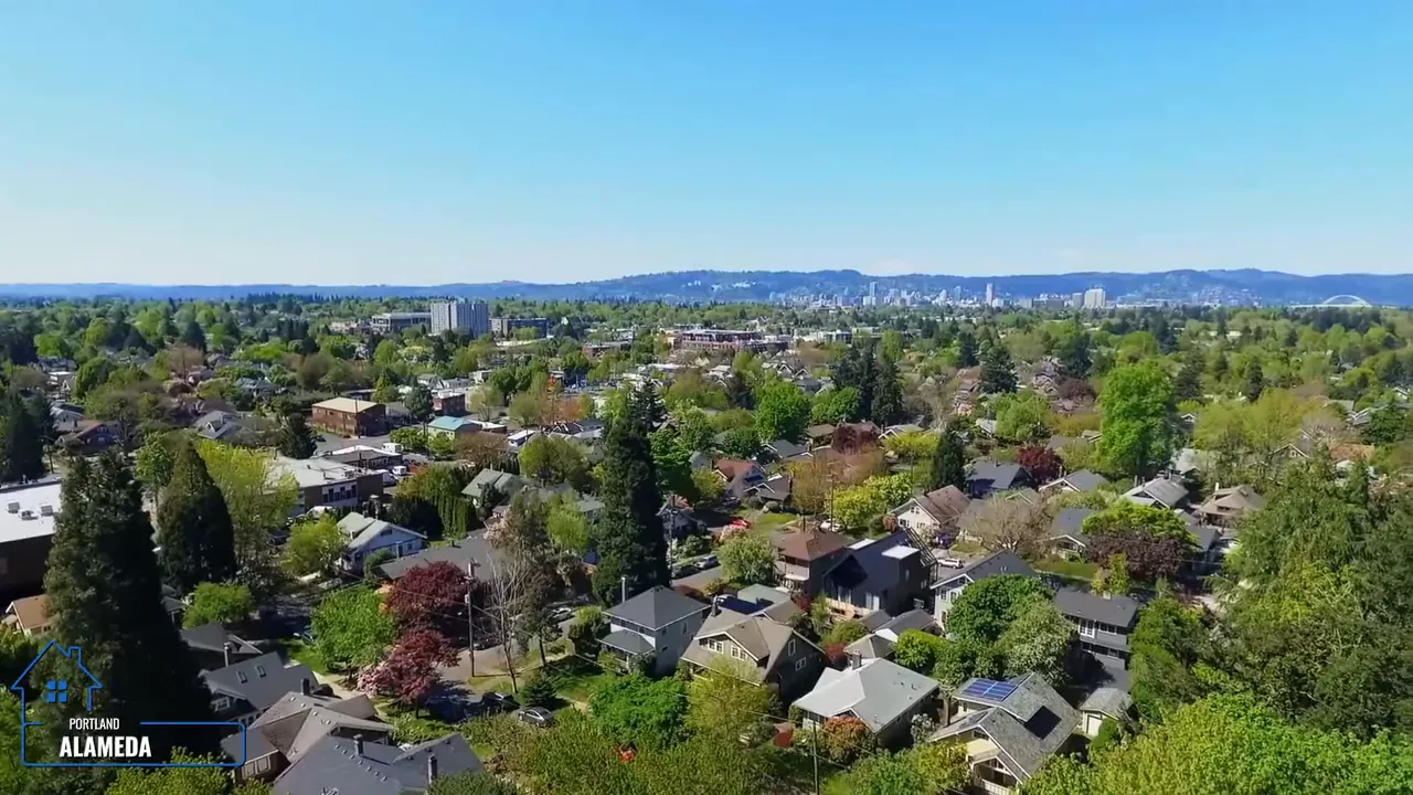 Aerial view from Alameda ridge looking across homes toward the city skyline