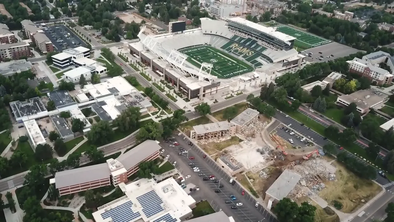 Aerial view of Fort Collins near a stadium and downtown buildings