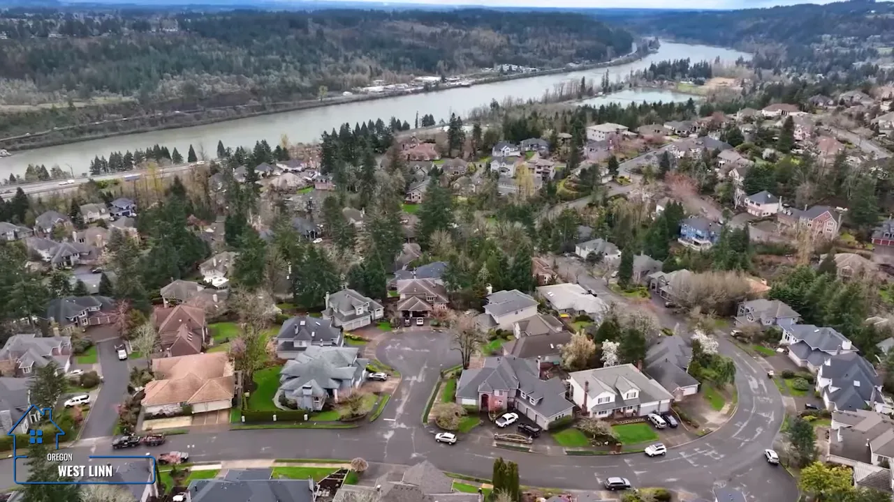 Aerial view of residential neighborhoods in West Linn, Oregon with a river in the background