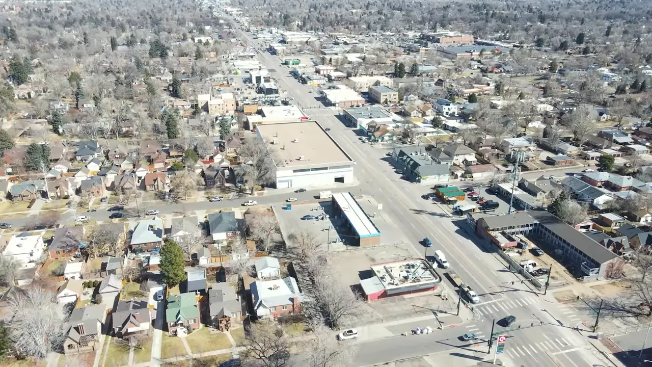 Aerial view of an older residential pocket and shopping area in the Denver-Aurora area