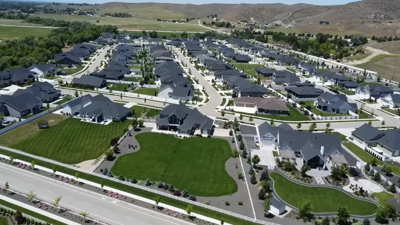 Aerial view of Dry Creek Ranch neighborhood with main road, homes, and expansive yards