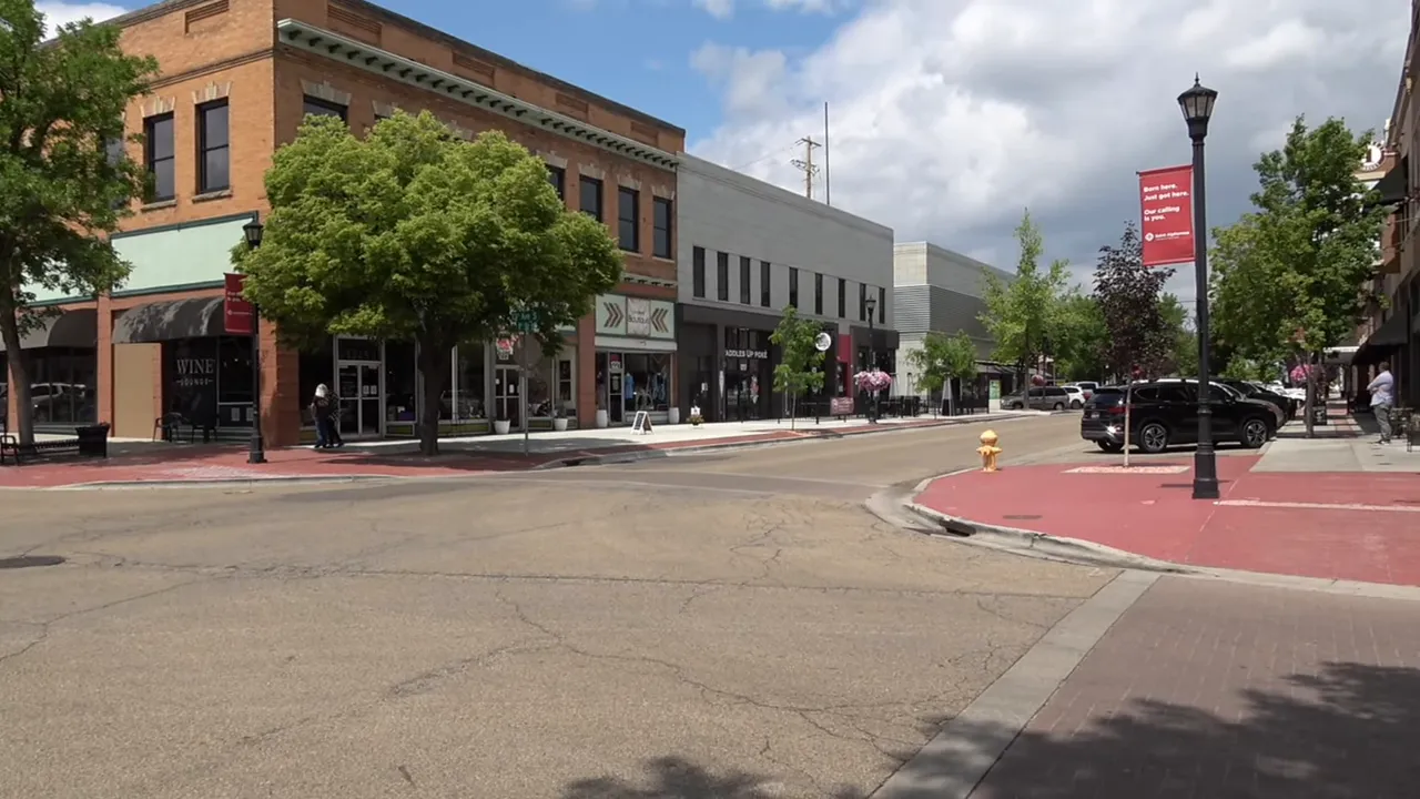 Downtown-style Main Street streetscape with brick buildings and storefronts near Meridian or Nampa