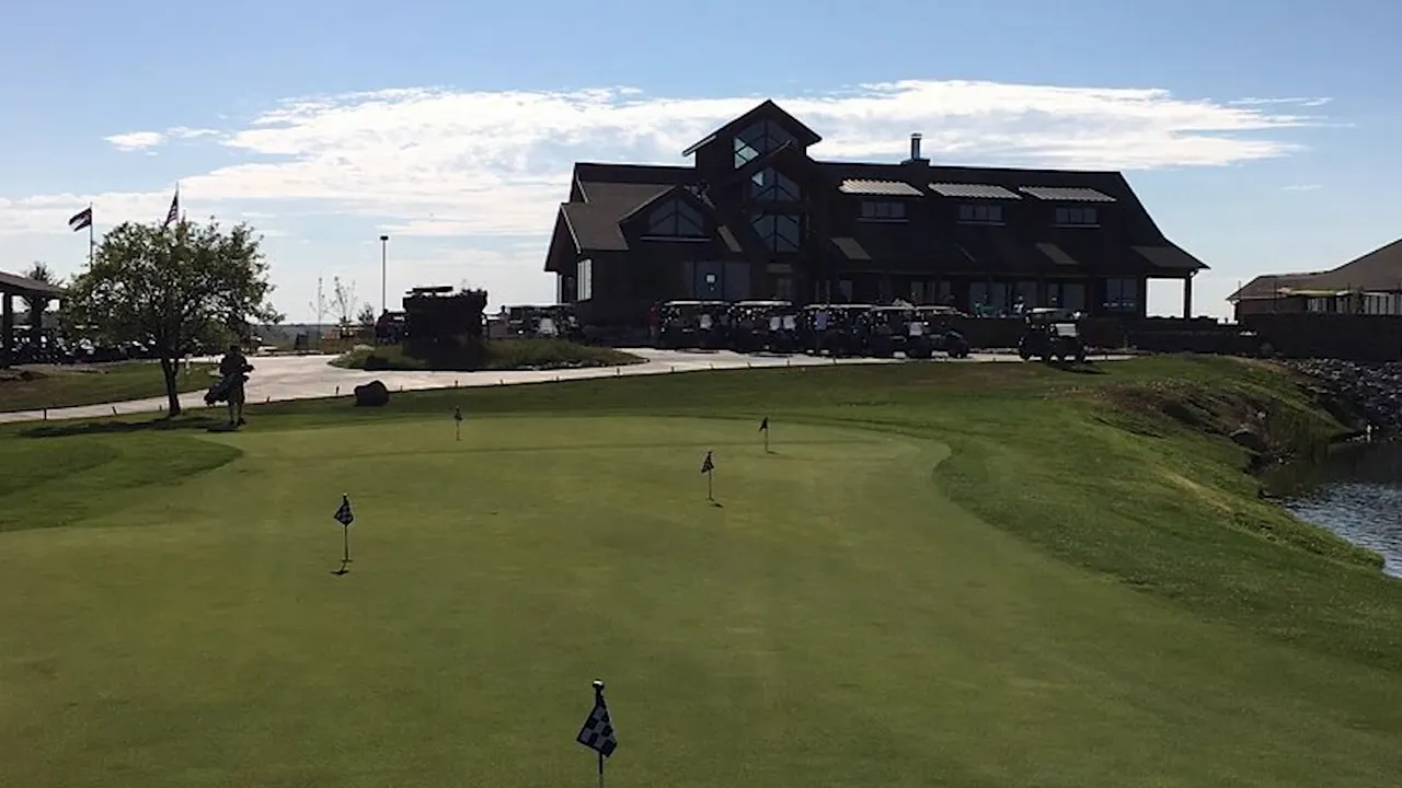 golf practice green and clubhouse building at Saddleback