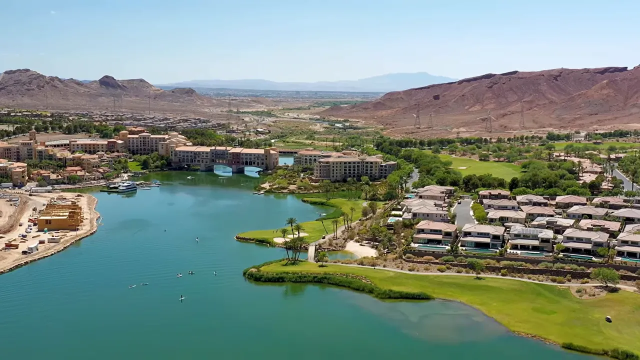 Wide aerial view of Lake Las Vegas with homes around blue water