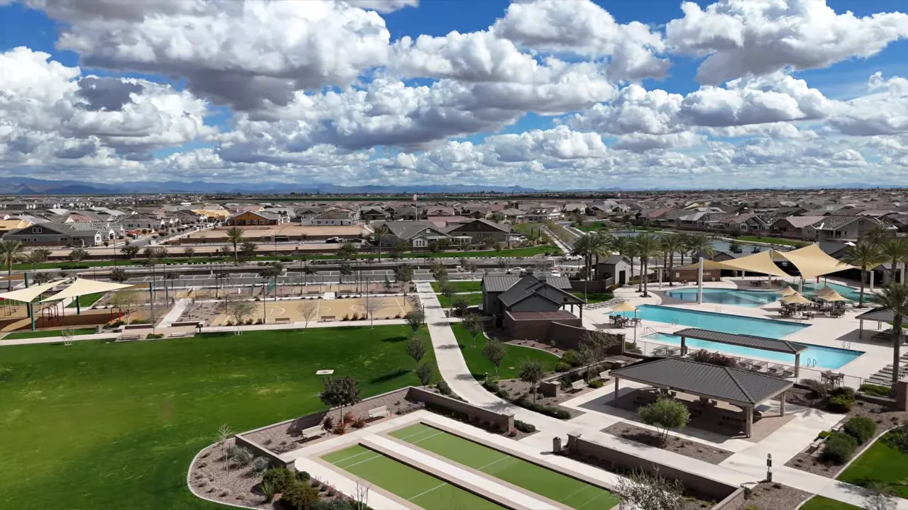 Aerial view of sports courts, green space, and pool complex at Barney Farms
