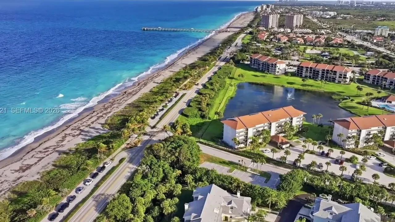 Aerial view of Sea Colony beside the ocean with homes and coastline stretching north and south