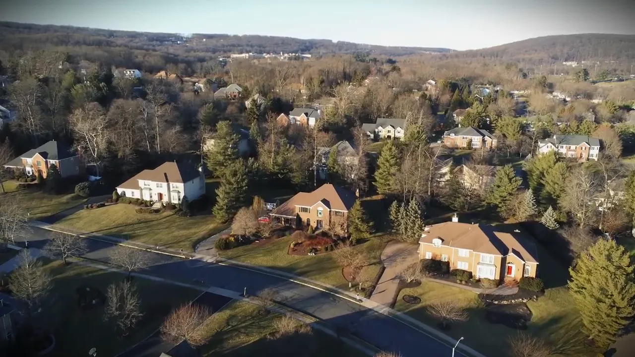 Aerial view of suburban neighborhood in Morris County, New Jersey with single-family homes and tree-lined lots