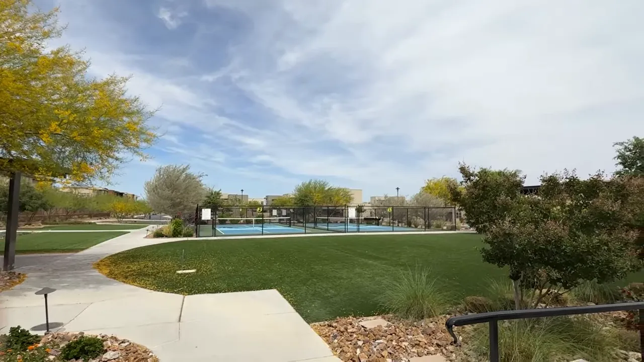 Scenic outdoor court complex with pathways and landscaping at a Las Vegas retirement community
