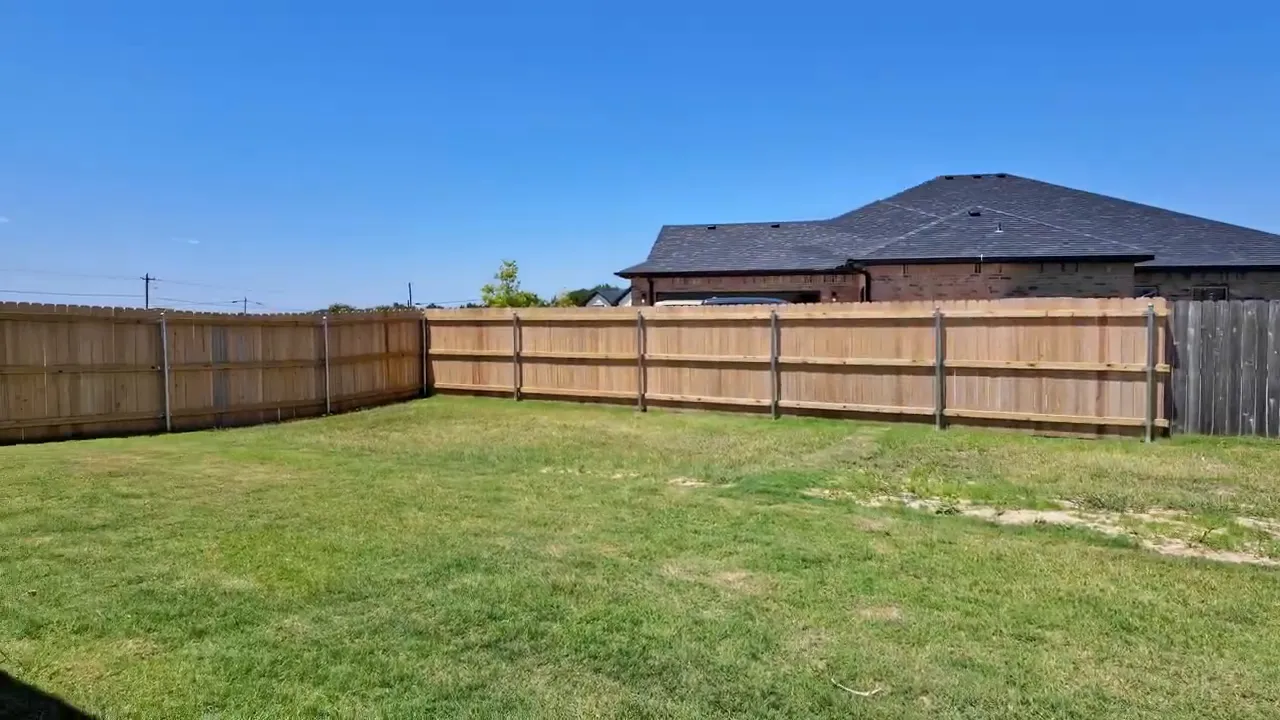 Large fenced half acre backyard with grass and open space