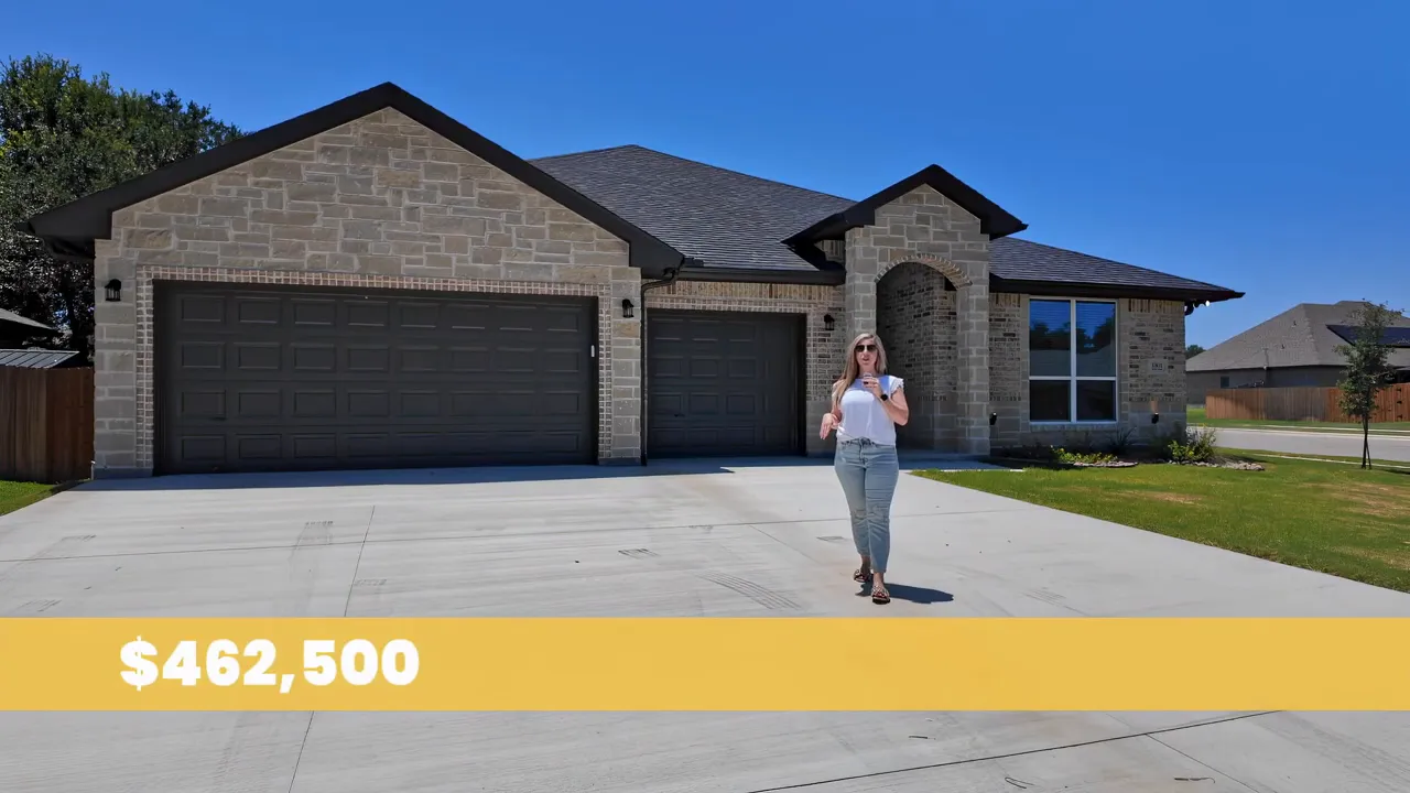 Brick and stone Salado home with three car garage