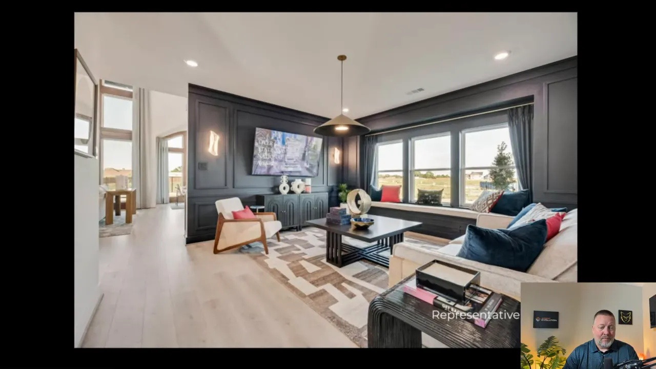Park Place by Grand Homes representative living room with large windows and fireplace wall