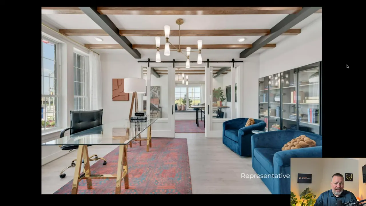 Luxury model home interior with high ceiling beams and glass doors
