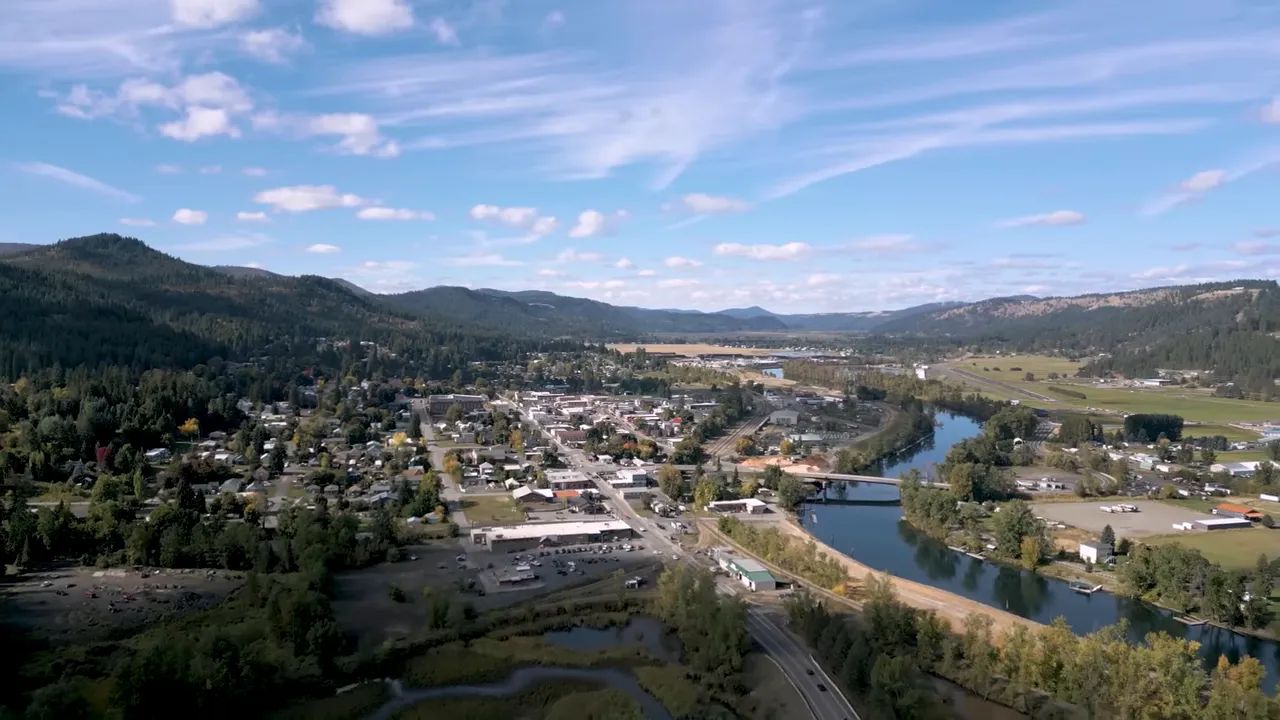 aerial view of St. Maries with river, town grid, and surrounding hills