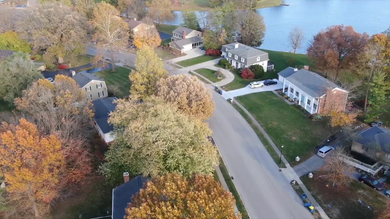 Aerial view of a heavily wooded Carmel neighborhood labeled Brookshire Golf Course