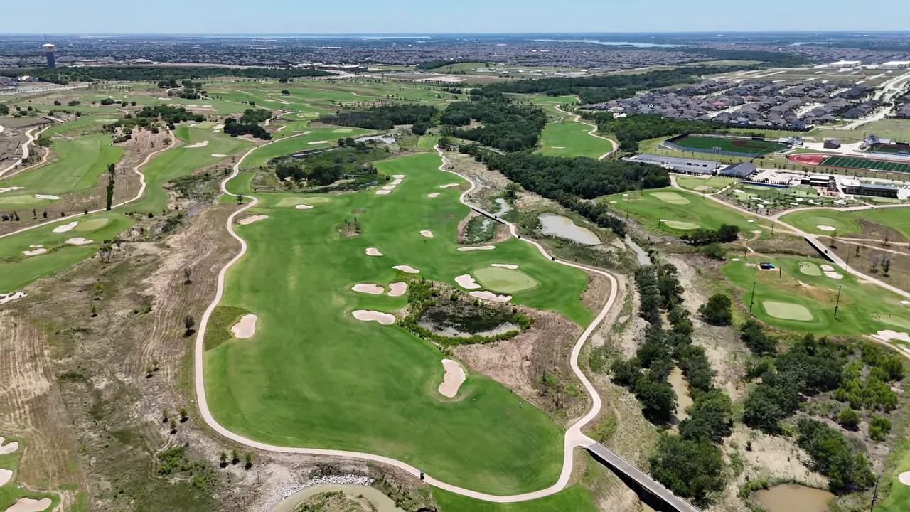 Aerial view of championship golf courses at Fields of Frisco showing fairways, greens, and clubhouse areas