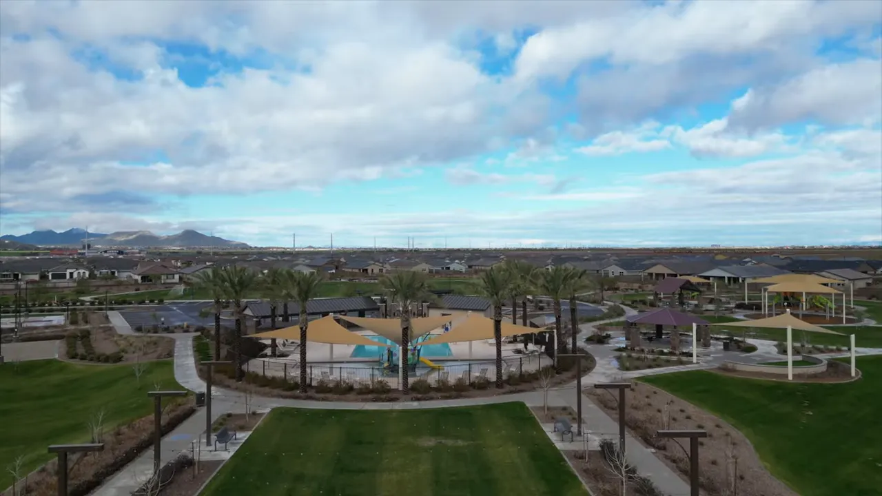 Aerial view of landscaped community park and swimming pool