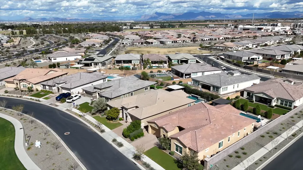 Aerial view of a large suburban neighborhood with many newer homes