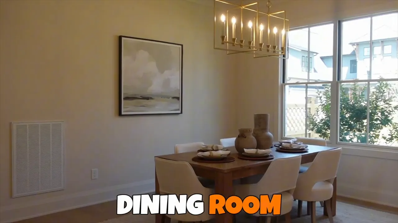 Dining room with table chairs chandelier windows and wall art