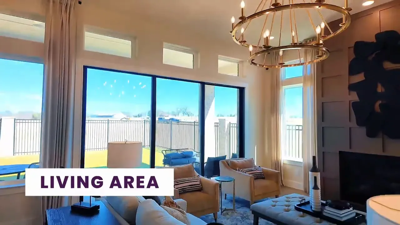 Bright living area with large sliding doors and chandelier in a new construction home