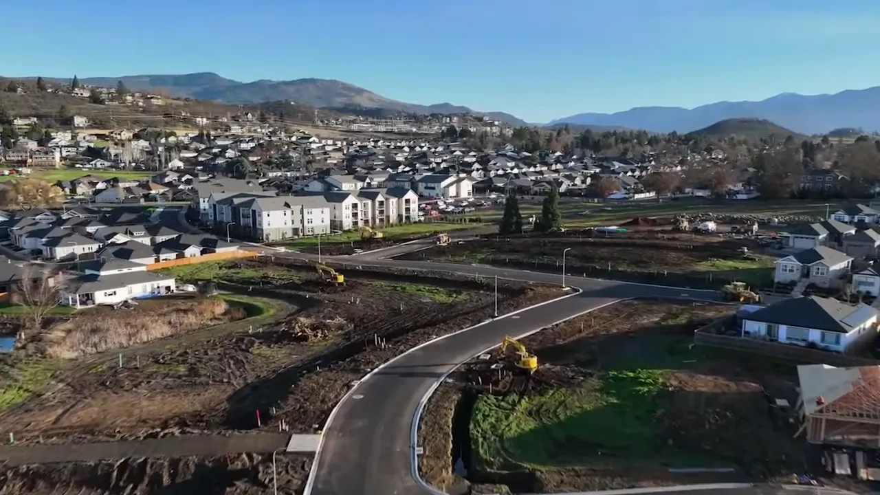 Aerial view of Medford Oregon residential development with new roads and construction sites
