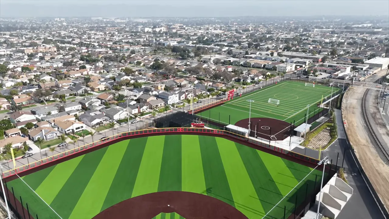 Aerial view of residential neighborhoods beside sports fields