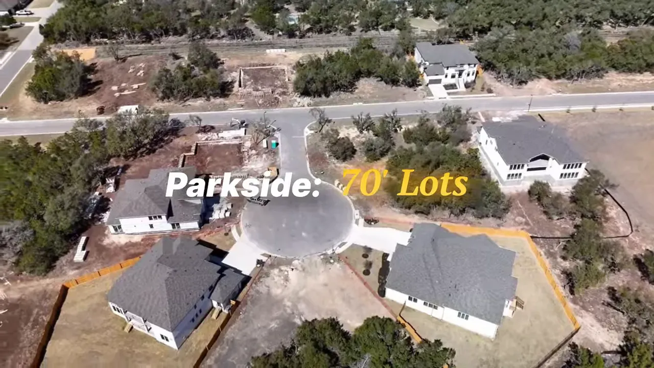 Aerial view of Parkside on the River development with highlighted text 'Parkside: 70' Lots' and surrounding homes
