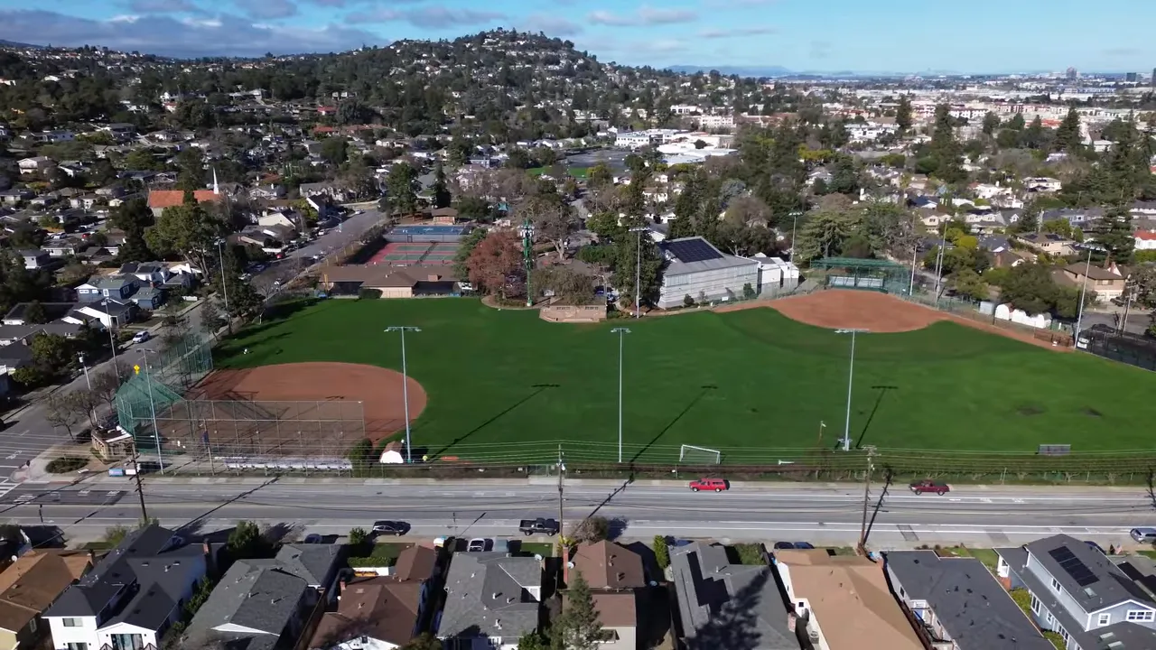 Aerial view of Burton Park with baseball diamonds, tennis courts and large grassy field