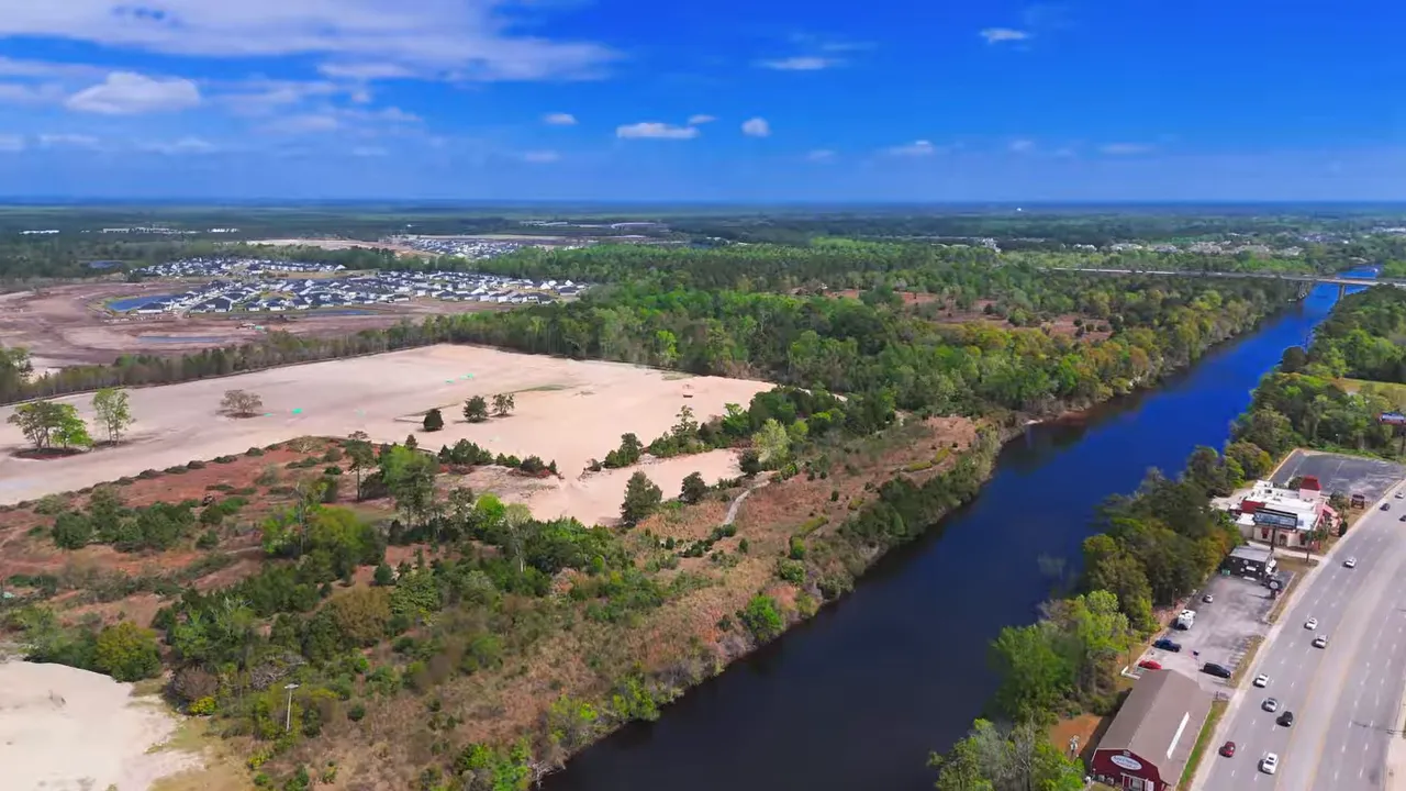 Aerial view of the Intracoastal waterway area near Myrtle Beach SC showing riverside access and nearby community land
