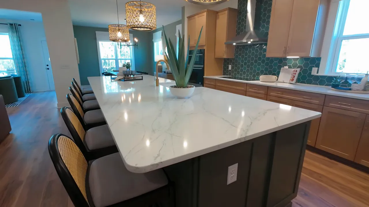 Oversized white kitchen island with six counter stools