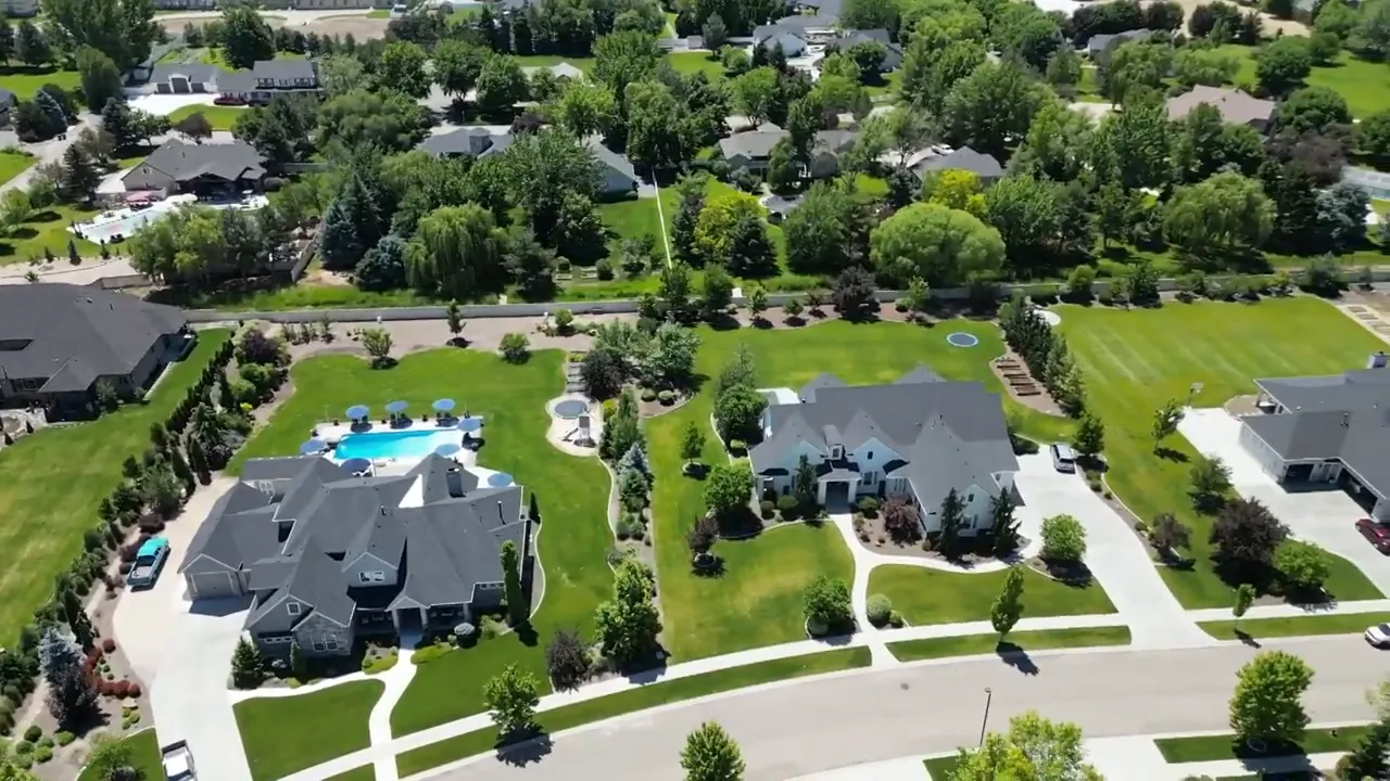 Aerial view of large homes on spacious lots with green yards in Eagle