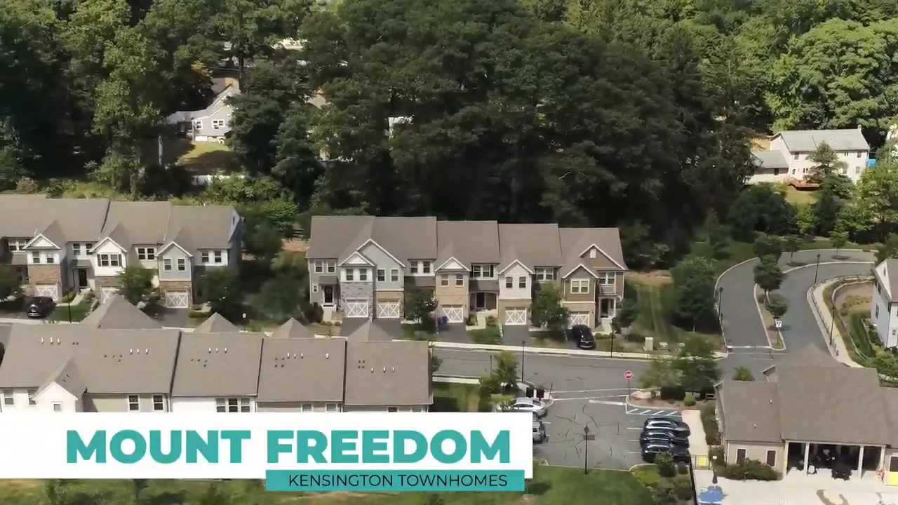 Aerial view of townhouse neighborhood in Mount Freedom with surrounding trees