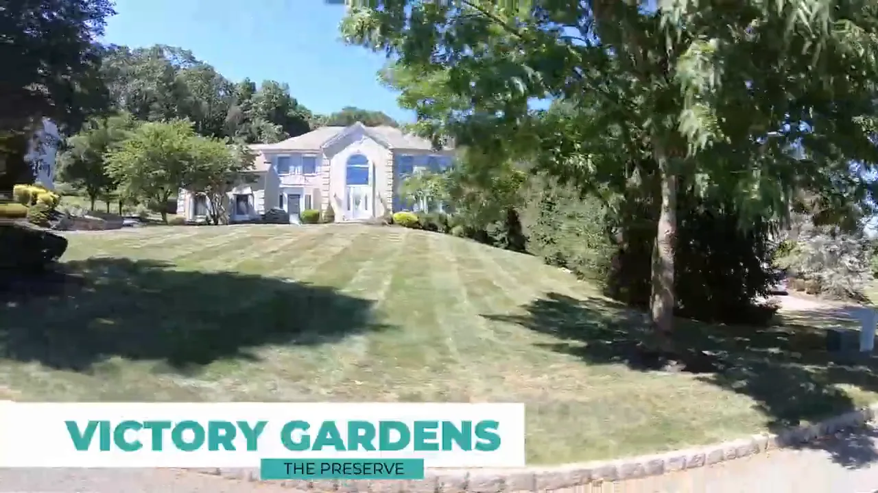 Large home on a sloped lawn in Victory Gardens neighborhood