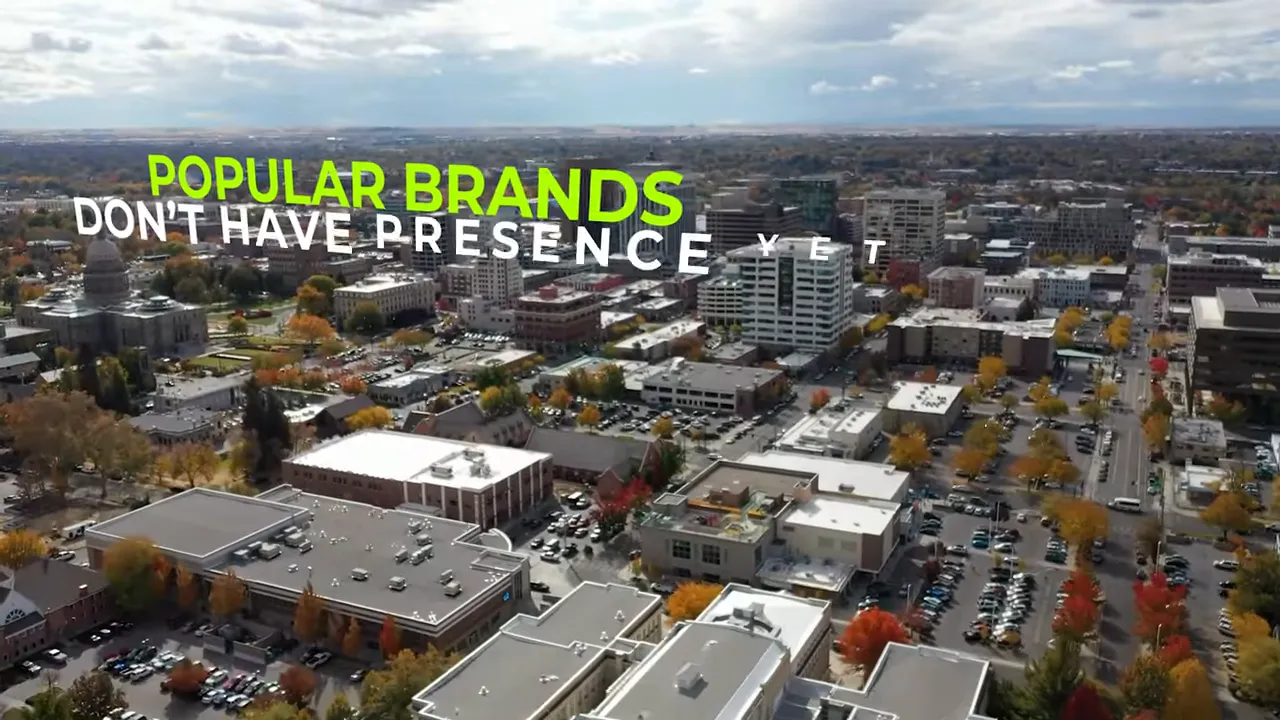 Aerial city view with text stating popular brands do not have presence yet