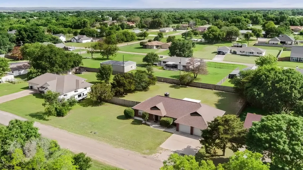 Aerial view of large residential lots with wide spacing between homes in a Woodway neighborhood