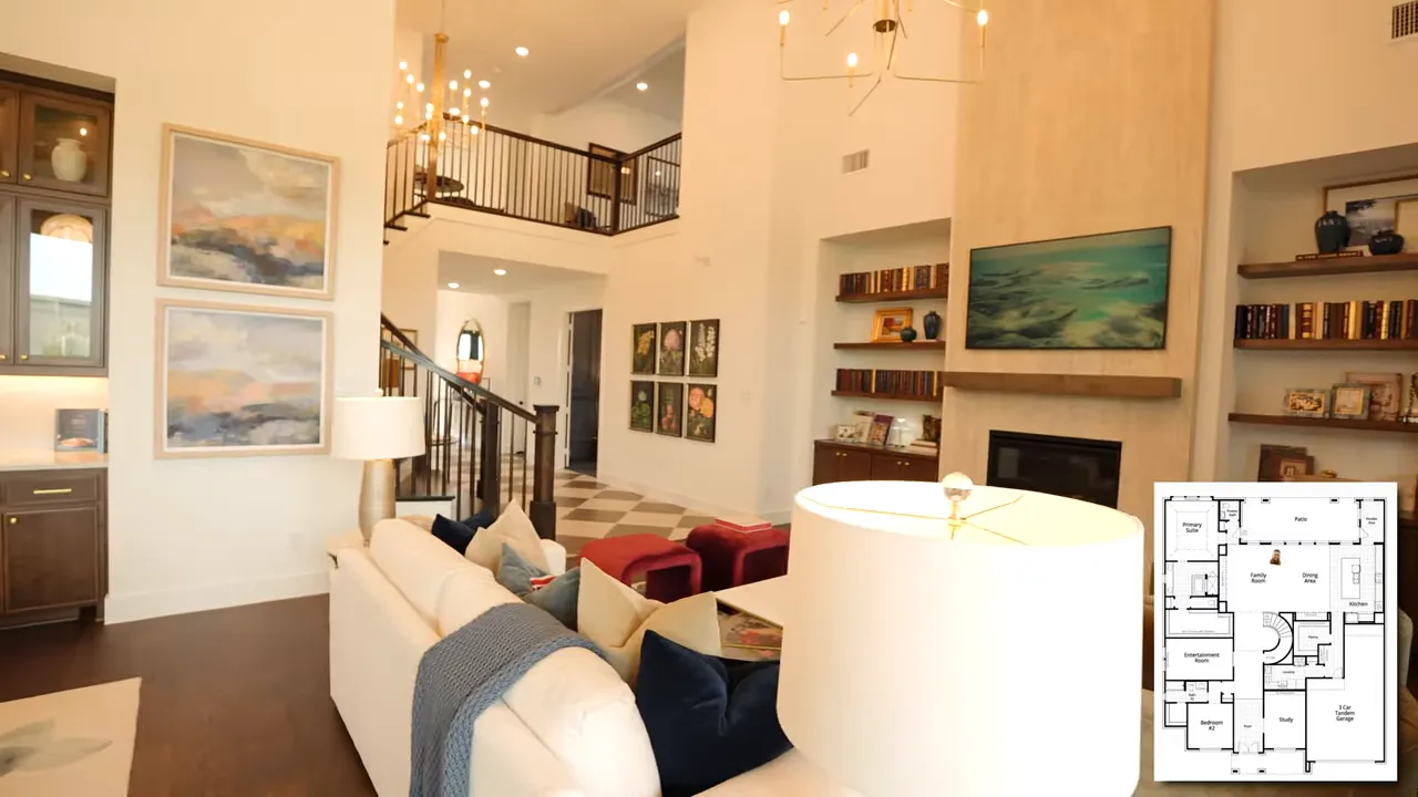 Open main living area showing dining room living room fireplace and upper overlook