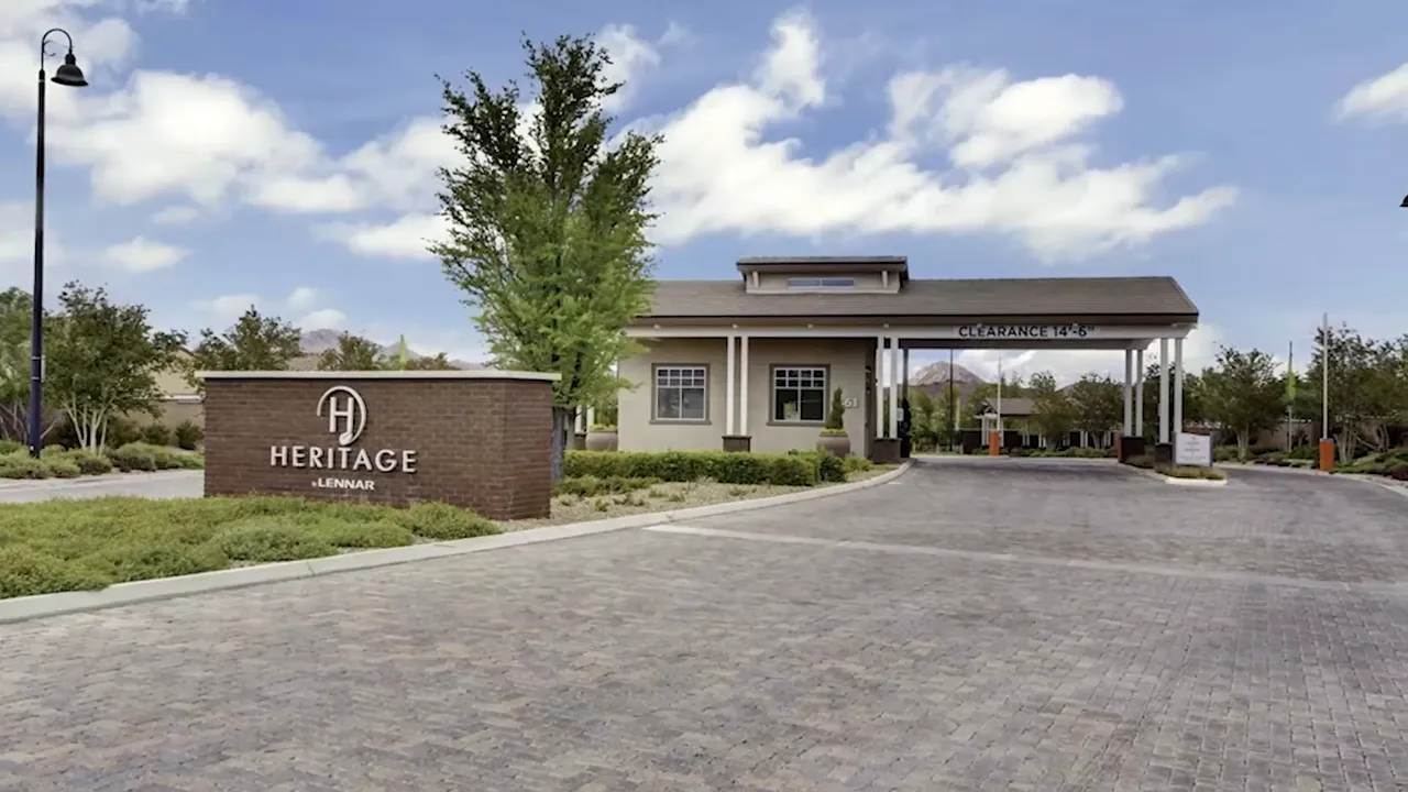Heritage at Cadence guarded entrance with community sign and gatehouse
