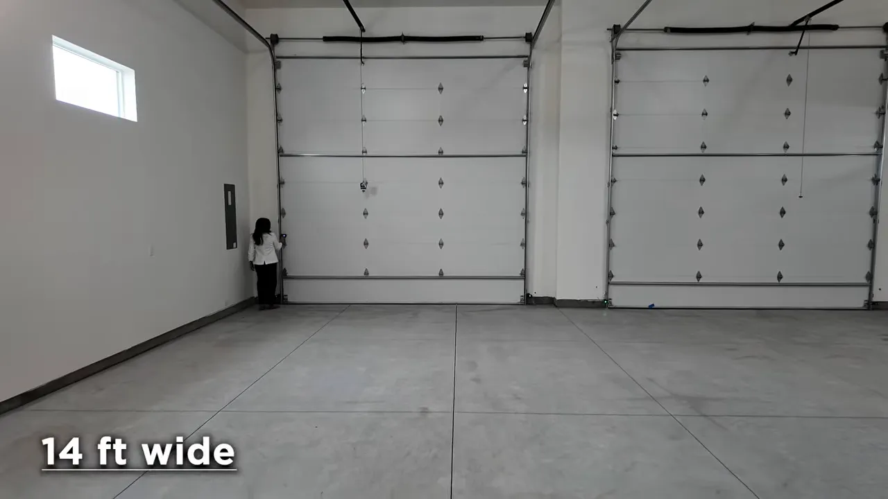 Finished RV garage with overhead doors and visible 14 foot wide text
